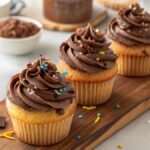 Vanilla cupcakes with chocolate frosting